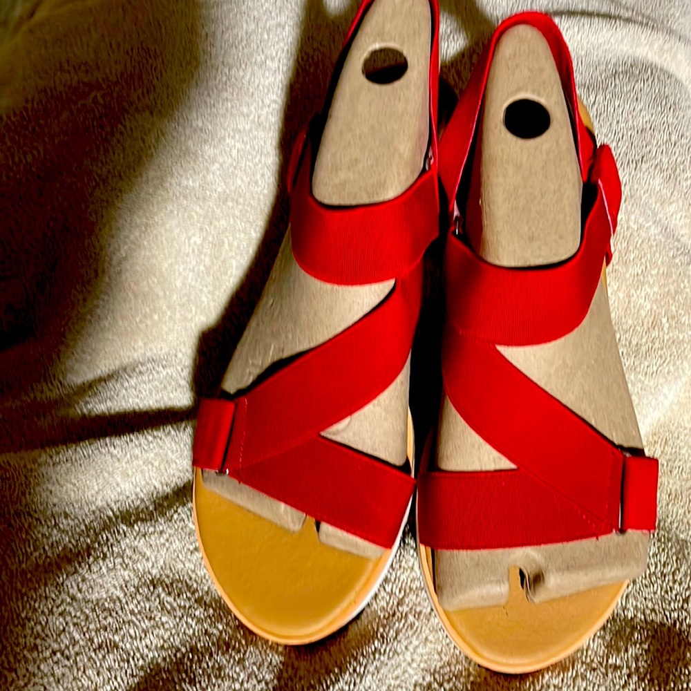 Red sandals cork & rubber bottom and elastic red straps. Size 12m